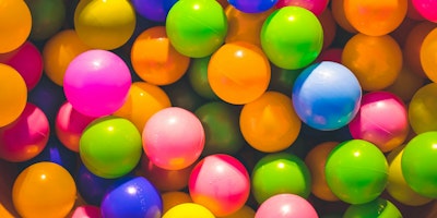 Brightly colored balls, as in a ball pit