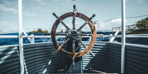 A ship's old-fashioned wooden steering wheel