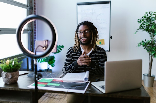 Man in front of a camera recording a video 