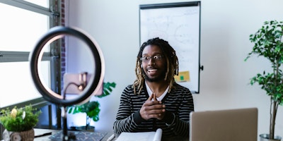 Man in front of a camera recording a video 