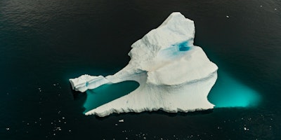 The tip of an iceberg in a sea of water