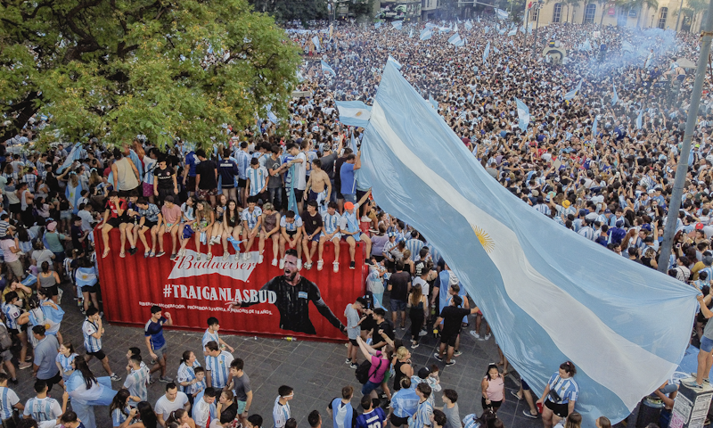 Argentina fans celebrate next to a shipping container full of Bud