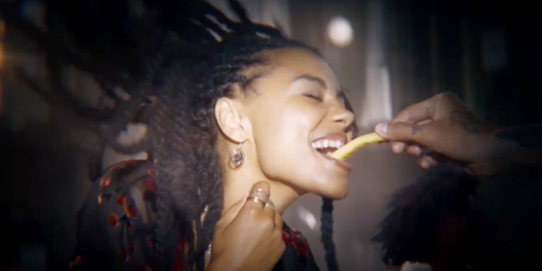 woman being fed a french fry